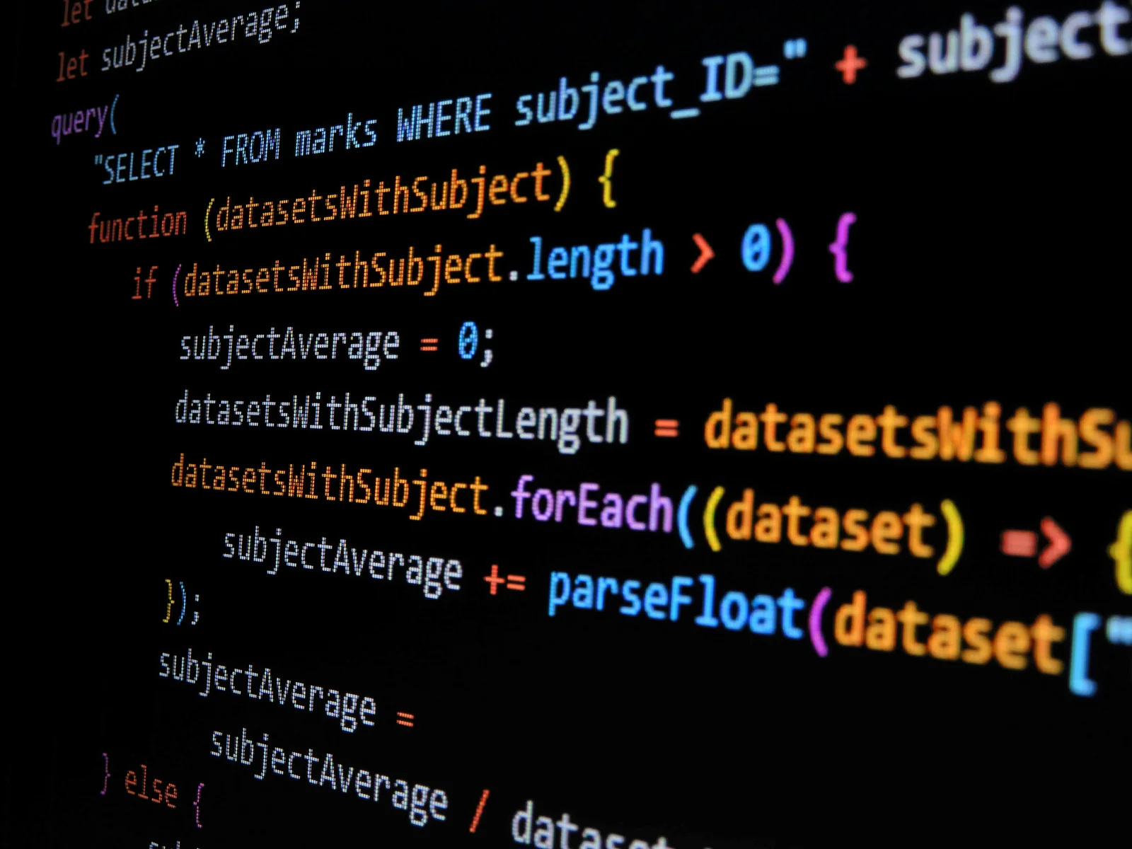 Close-up of JavaScript backend code with syntax highlighting on a dark screen